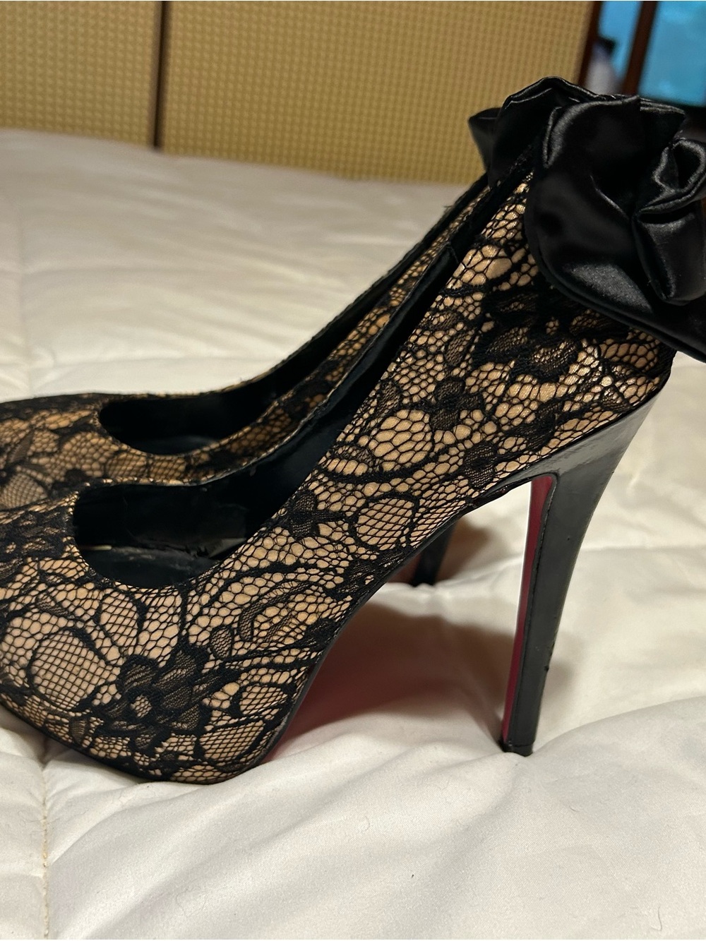 Signature Black Lace Pumps with Nude Underlay and Satin Bow